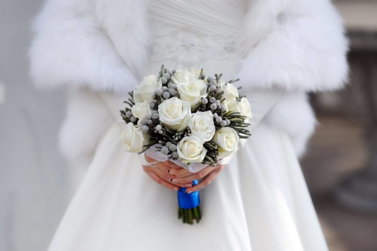 What To Wear Over A Wedding Dress In Winter 24 winter bride in dress and coat