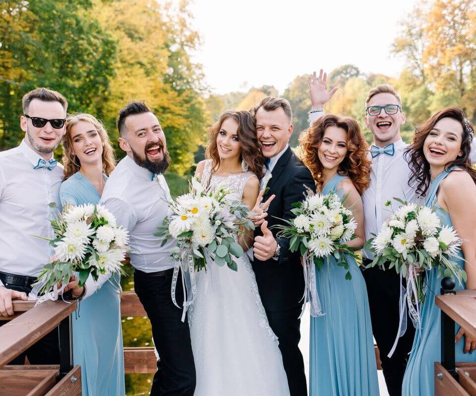 The Ultimate Guide to Planning a Wedding in Leeds 3 Newlyweds after wedding in Leeds, a bride and groom stand with their bridesmaids, best man and groomsmen.