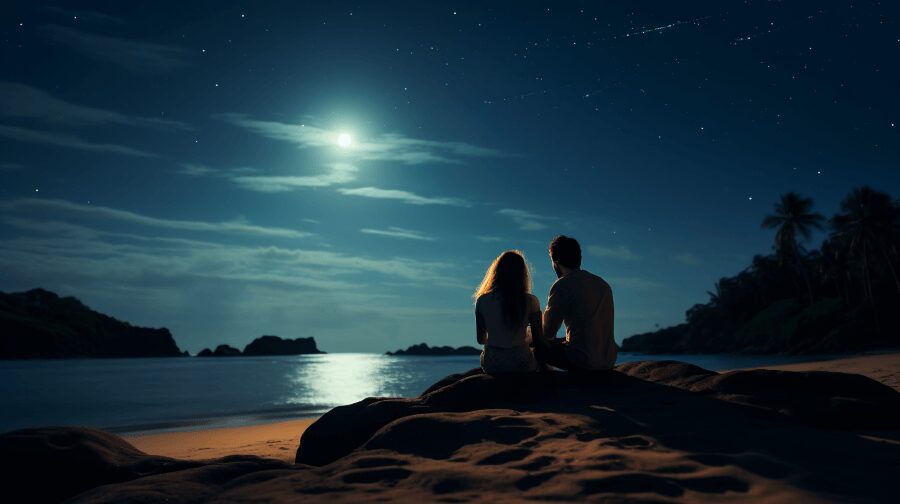 31 Things To Do On Your Honeymoon for 2024 11 couple on beach stargazing
