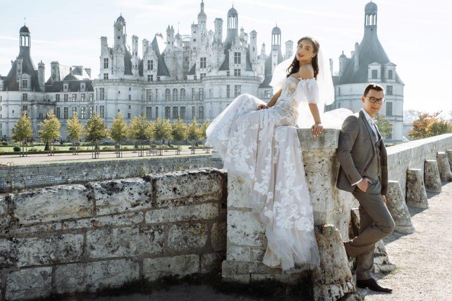 Ultimate Guide to Marrying in France 5 bride and groom standing in front of french castle