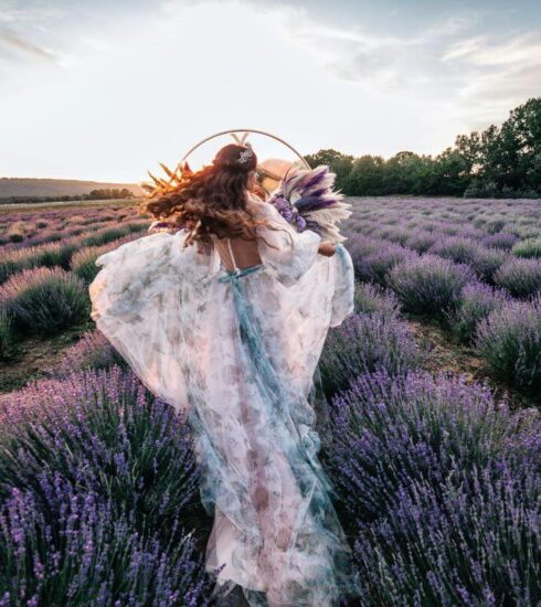 Ultimate Guide to Marrying in France 13 bride running through lavender fields in france