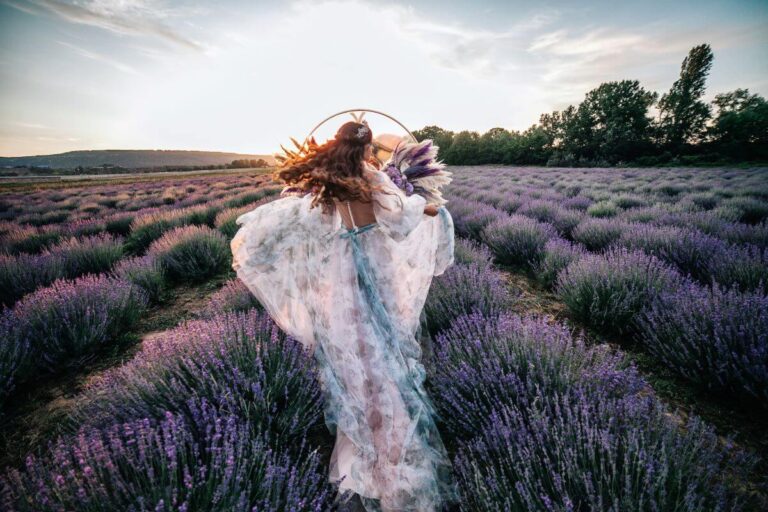Ultimate Guide to Marrying in France 32 bride running through lavender fields in france